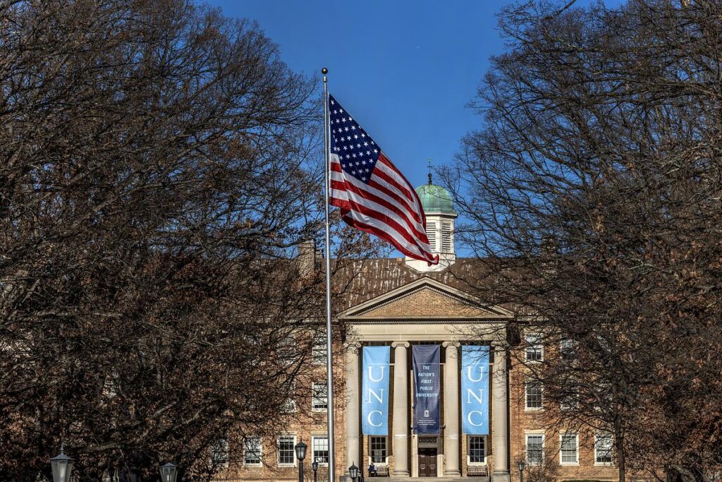 The American flag flies outside of South building.