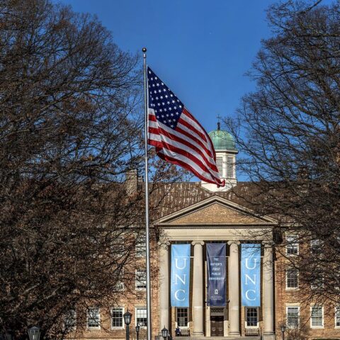 The American flag flies outside of South building.